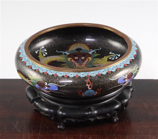 A Chinese cloisonne enamel dragon shallow bowl, Ming mark, early 20th century, diam.20.5cm, ebonised wood stand